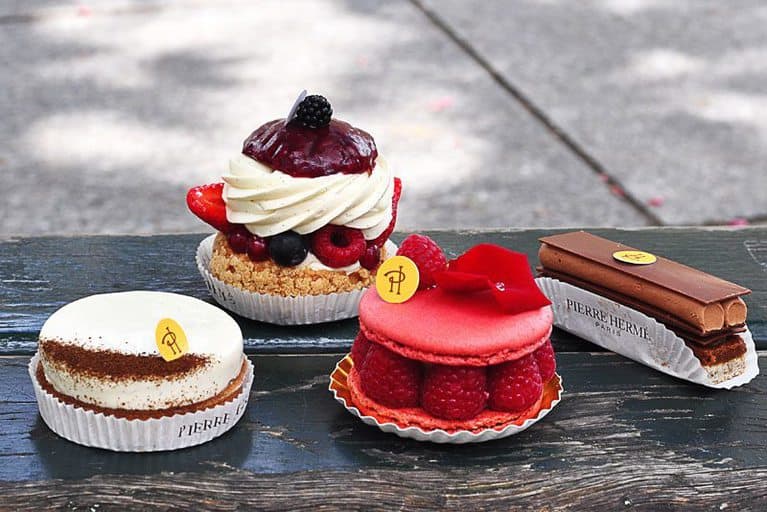 From right to left: Pleasure Sugar, Isfahan, profiteroles filled with mascarpone and berries, and an endless vanilla tart