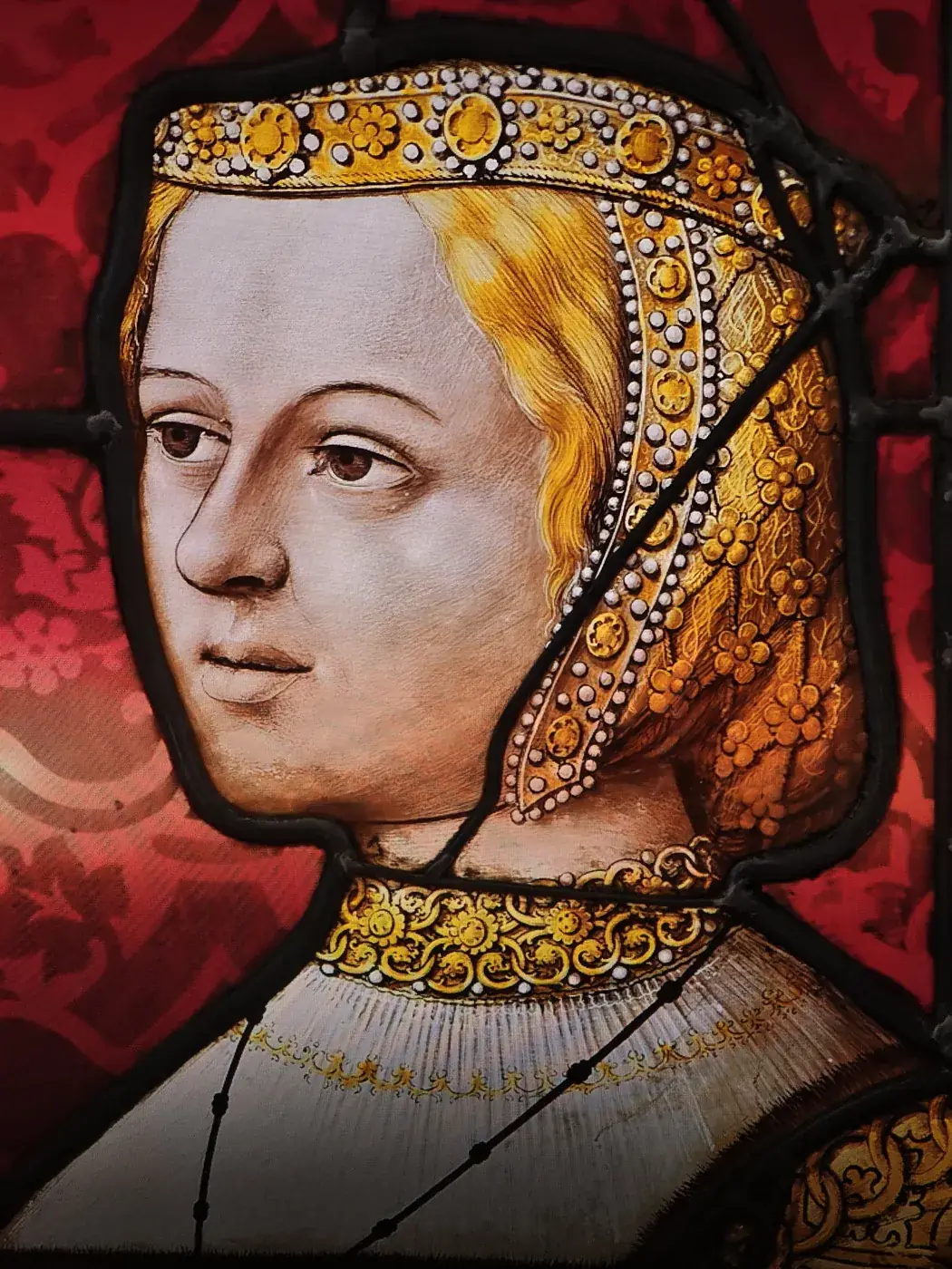 Portrait of a woman in court dress, detail from a stained glass window at the Brou monastery. Photo by Zvi Chazanov